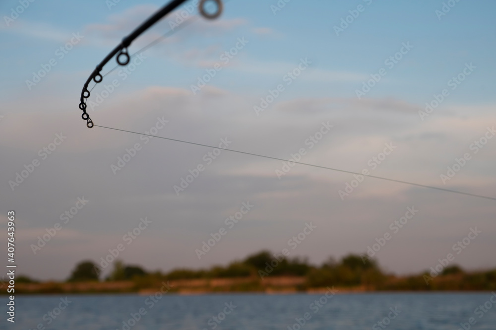 Feeder fishing on the lake. Focus on fishing rod. Feeder fishing on the lake. Focus on fishing rod.