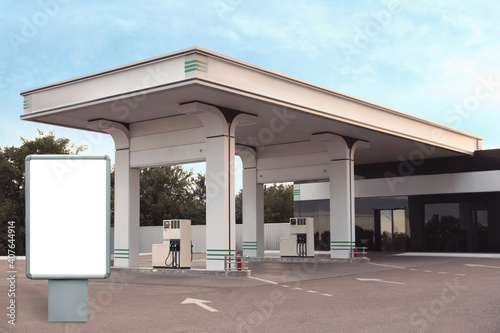 Fototapeta Naklejka Na Ścianę i Meble -  Empty billboard on modern gas station outdoors, space for design