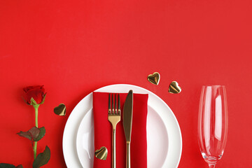 Romantic table setting on red background, flat lay with space for text. Valentine's day celebration