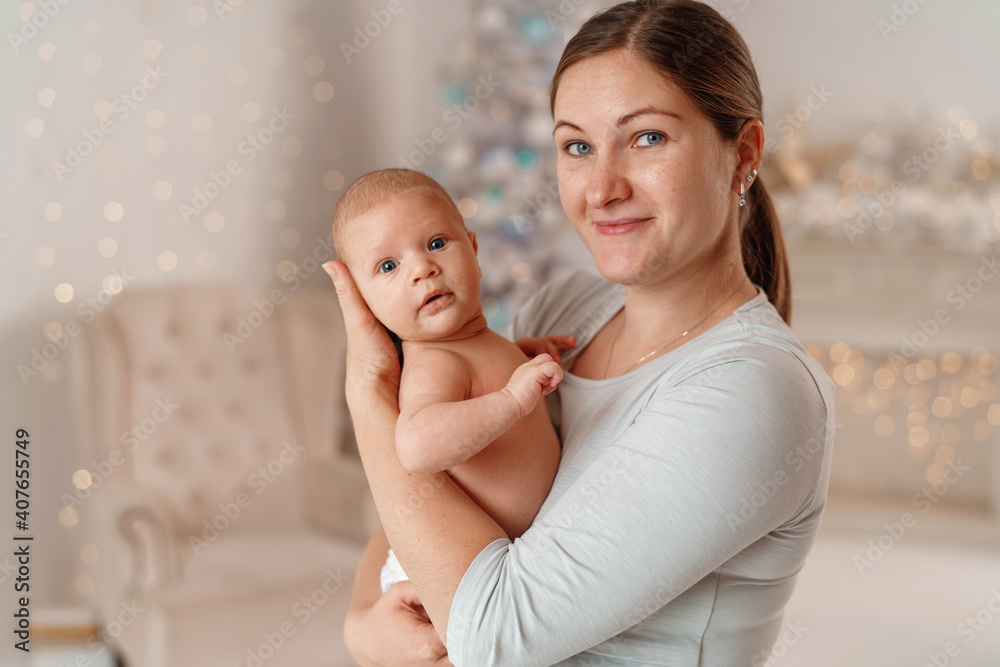 Happy loving family. A young mother plays with her child in the bedroom. Happy loving family. A young mother plays with her child in the bedroom.