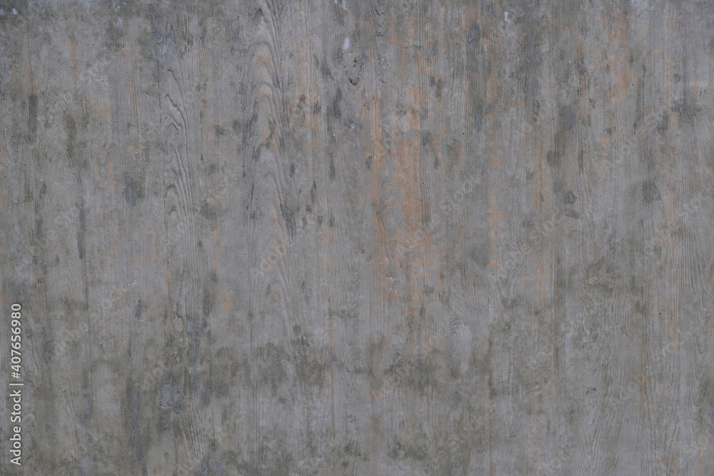 Textured background of an old wall made of beige plaster. Smooth surface. Copy space. Old peeling plaster wall, crumbles. Concrete is made under the gray wood texture.