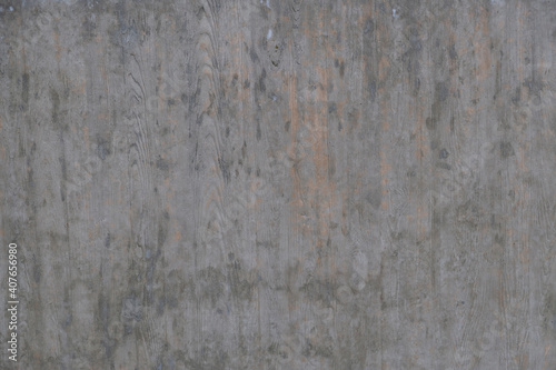 Textured background of an old wall made of beige plaster. Smooth surface. Copy space. Old peeling plaster wall  crumbles. Concrete is made under the gray wood texture.