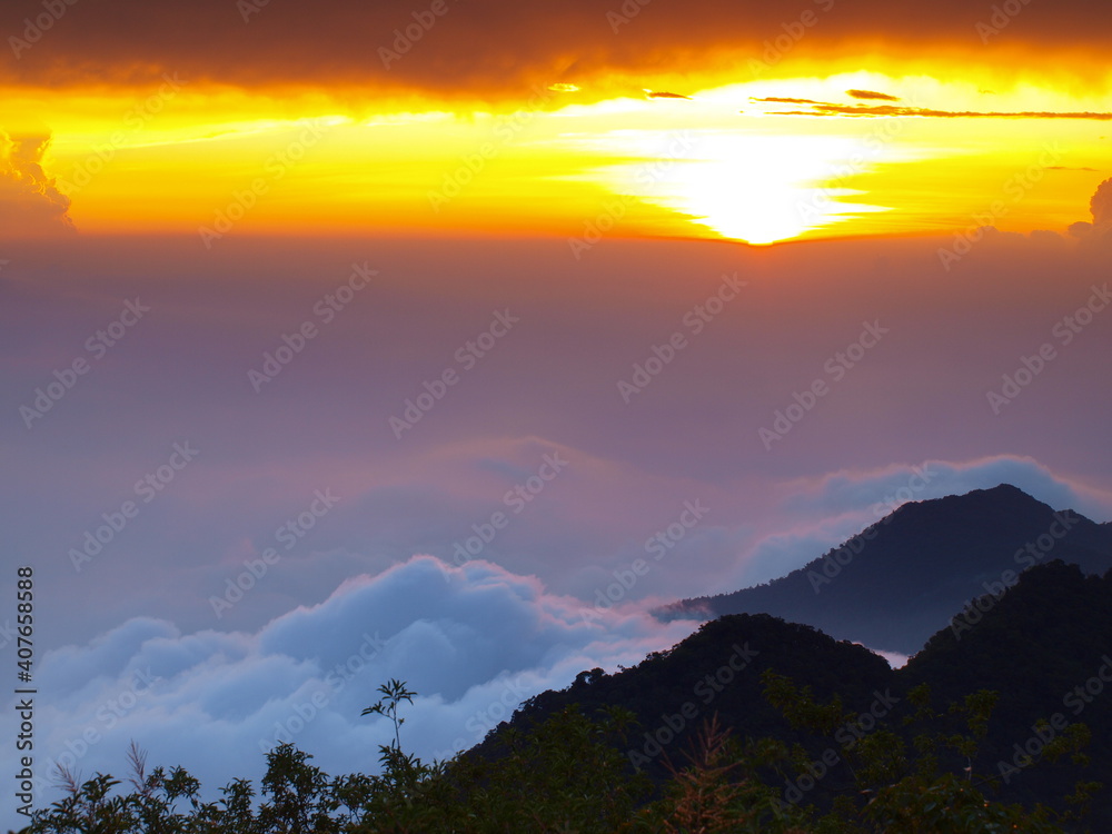 Fototapeta premium sunset with sea of clouds in the mountains