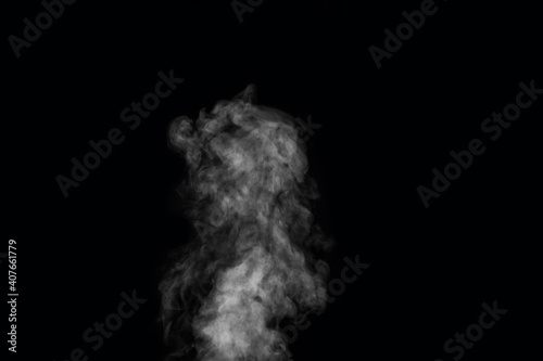 Fototapeta Naklejka Na Ścianę i Meble -  Figured smoke on a dark background. Abstract background, design element, for overlay on pictures.