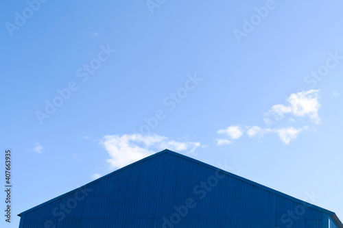 Triangle roof in front of the sky 