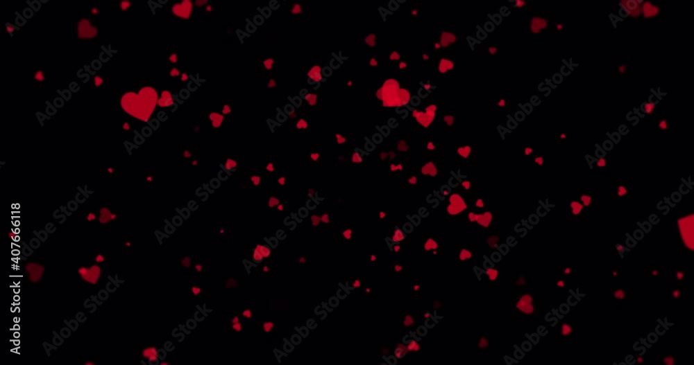 Red hearts floating around on a black background Red hearts floating around on a black background