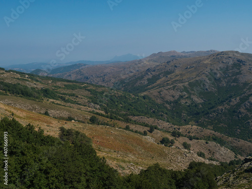 Mountain landscape in Gennargentu, highest mountain in Sardinia, Nuoro, Italy. Vaste peaks, dry plains and valleys with mediterranean vegetation. Late summer, blue sky © Kristyna