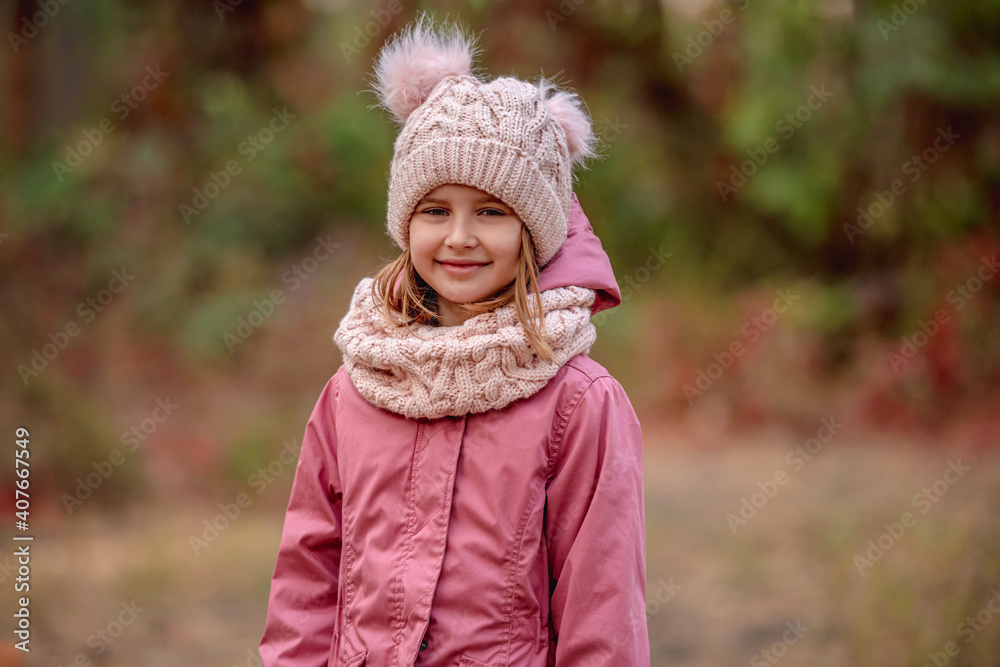 Little girl in knitted scarf and hat Little girl in knitted scarf and hat