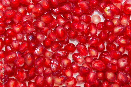 close-up on a pile of peeled pomegranate. selective focus