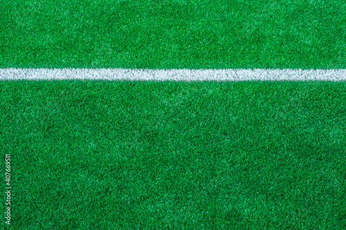 Green synthetic grass sports field with white line shot from above. Soccer  rugby  football  baseball sport concept