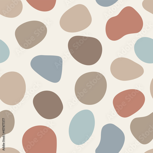 Vector abstract pebbles seamless pattern. Colorful artistic fluid organic shapes. Isolated neutral earth tone neutral colors graphic elements scattered on background. Natural backdrop illustration