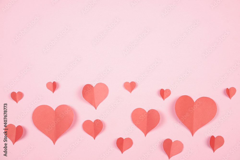 Heart shaped paper sticked on pink background. Emblem of love for happy women, beloved mother, birthday cards and valentine greeting designs. Valentine's day backgrounds. Templates to convey our love.