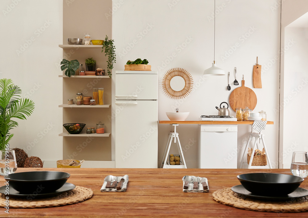 Kitchen close up dining room table decorative interior background style with dishwasher and refrigerator.