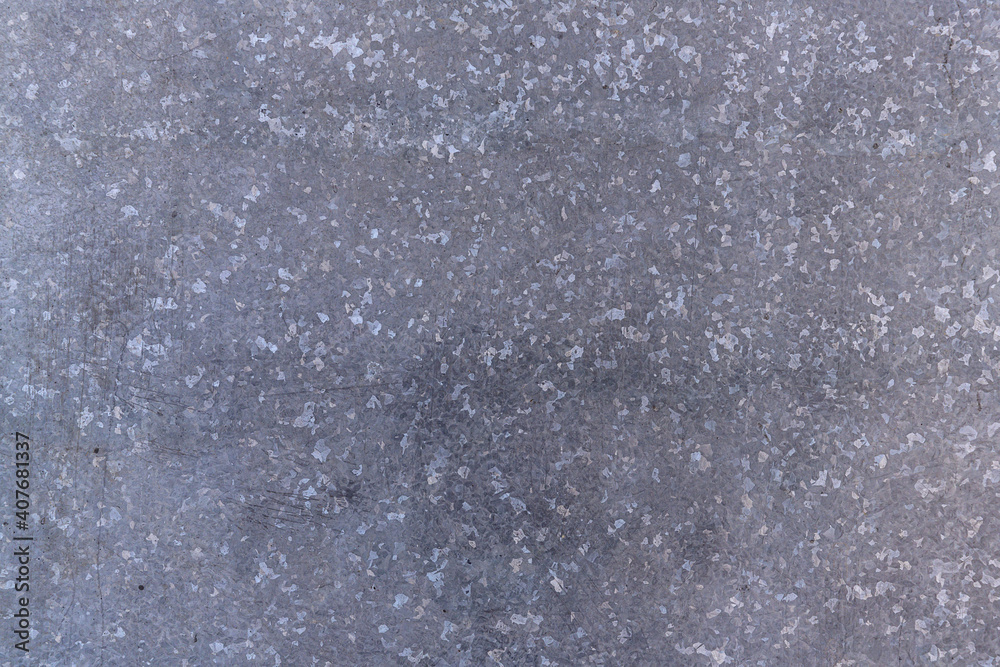 Obraz premium Blue-gray galvanized metal texture with speckles. close-up. Textured background. industrial sheets for building needs
