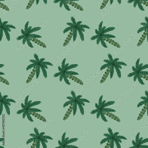 Seamless exotic nature pattern with doodle palm tree ornament in green tones on pale background.