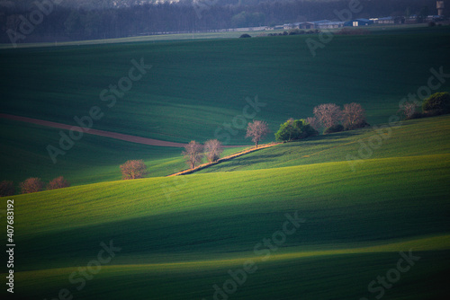 Moravian fields in czech republic. rural life during a sunny spring. arable fields prepared for sowing the grain.