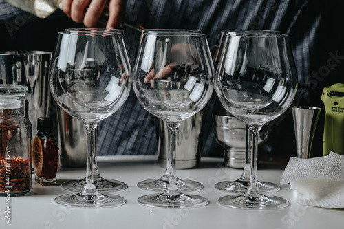 Ice in a glass of wine prepared for a special cocktail for a bartender's bar or restaurant.