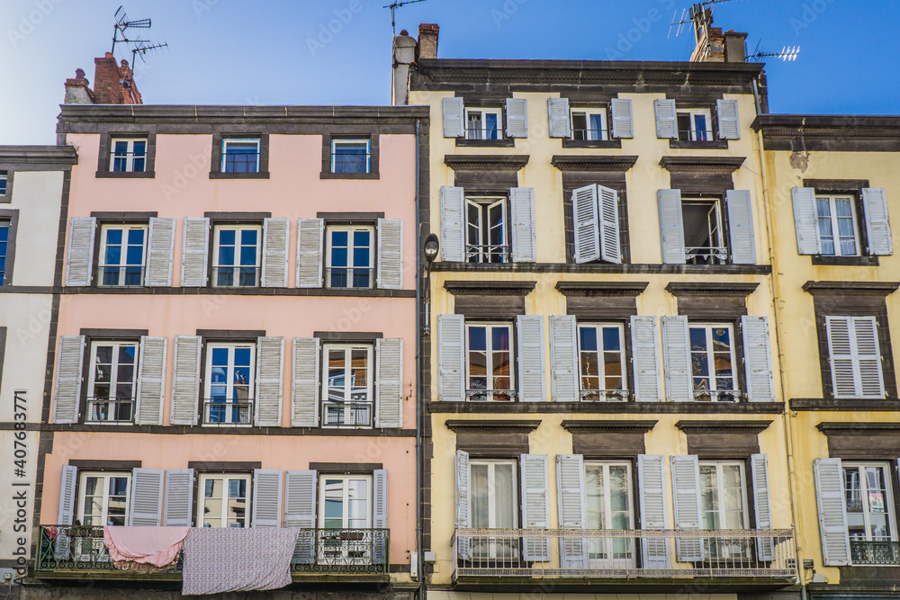 typical facades of houses in the streets of Clermont Ferrand, Auvergne (France). Here the Blatin street