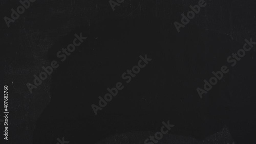 Hand man erasing with chalk 