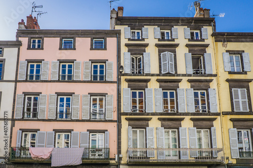 typical facades of houses in the streets of Clermont Ferrand, Auvergne (France). Here the Blatin street
