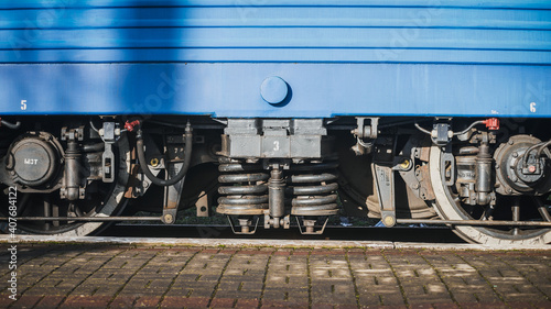 Truskavets, Ukraine - January 2021: Wheels of locomotive CHS7 with a freight train awaiting departure on the platform of the railway station. Ukrzaliznytsia. Ukrainian railways. photo