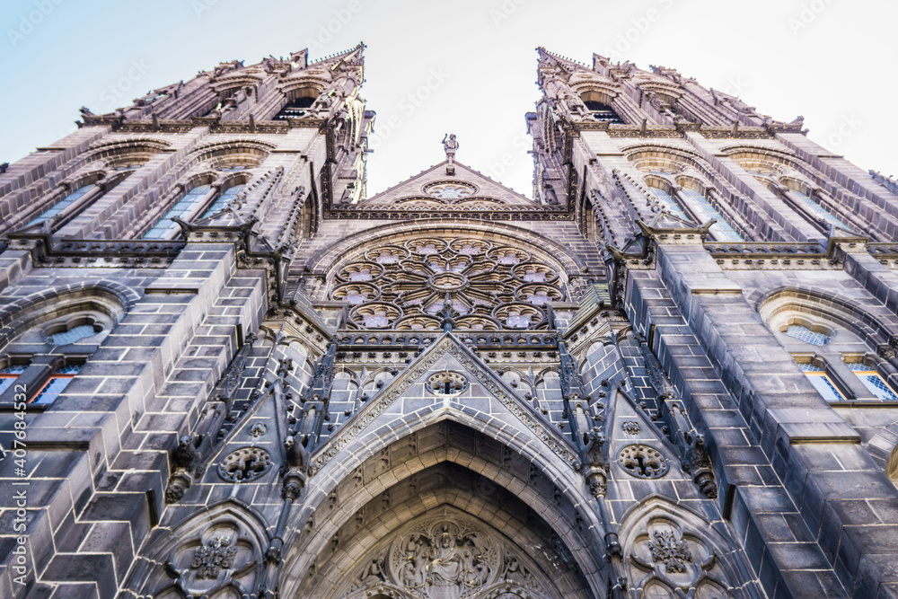 low angle shot of the facade of the gothic cathedral of Clermont-Ferrand, in Auvergne, France