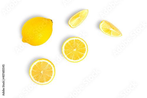 Lemon with lemon slices isolated on white background. top view
