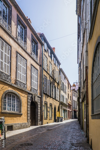 typical facades of houses in the streets of Clermont Ferrand, Auvergne (France)