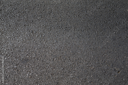 Close up black asphalt road surface texture.