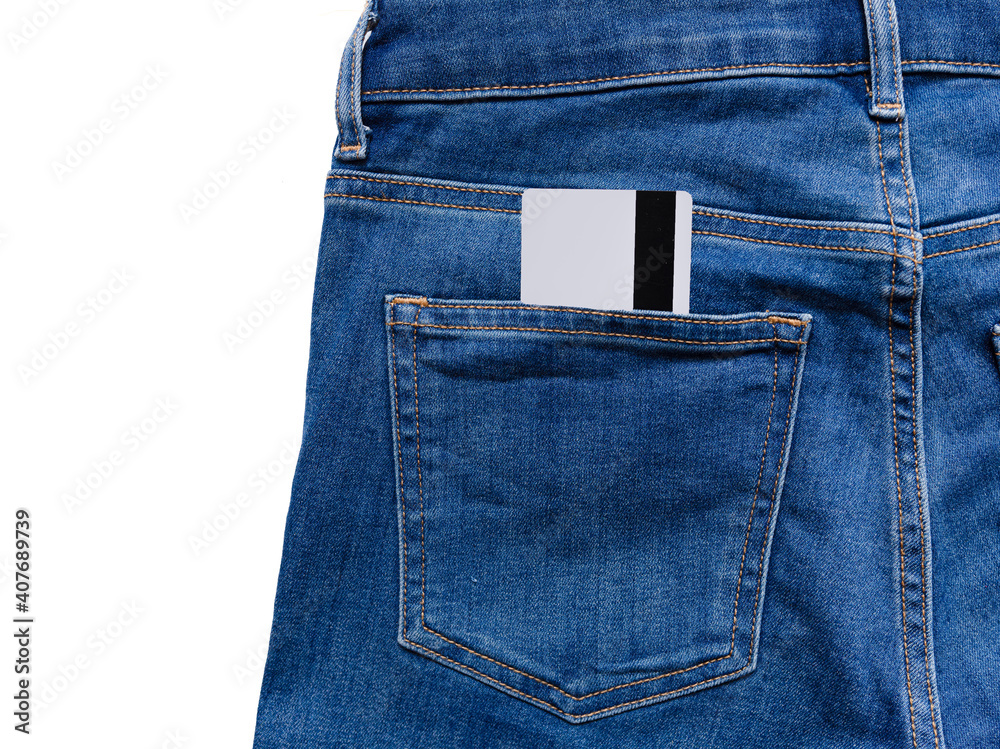 Credit card in the back pocket of jeans isolated. Theft concept. copy space