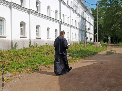 VALAAM, RUSSIA. A monk walks through the territory of the Valaam Transfiguration Stavropegial Monastery. Karelia photo