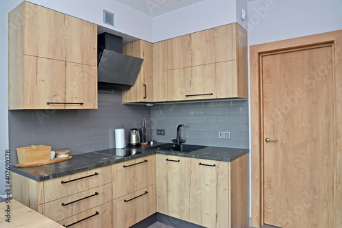Built-in cabinet furniture in the kitchen. Modern minimalism with loft elements