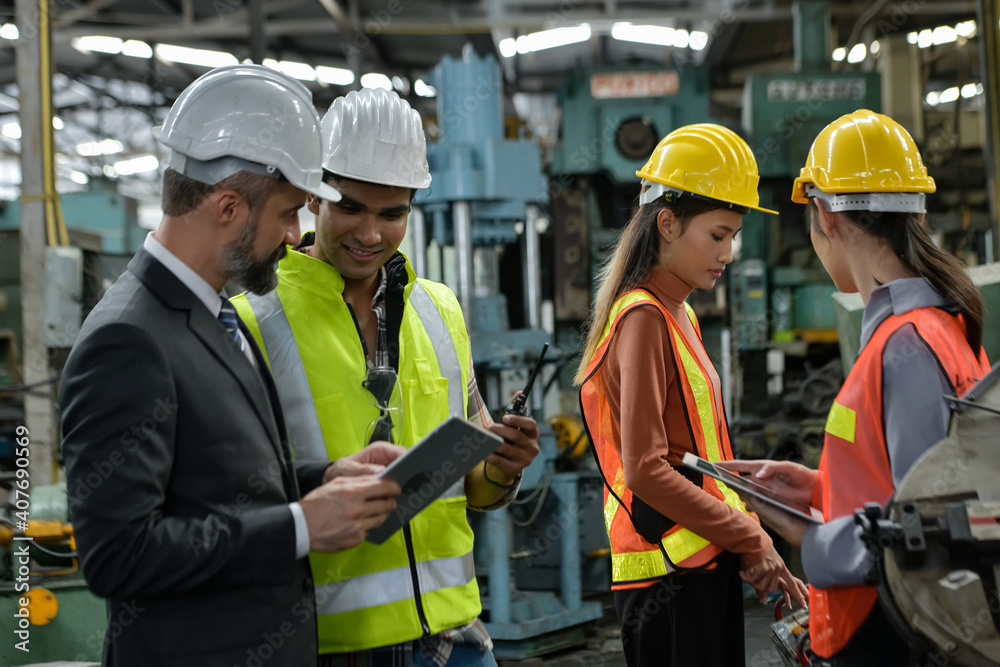Young engineer and management consultant about auto parts design at an auto parts factory in Thailand... Young engineer and management consultant about auto parts design at an auto parts factory in Thailand...