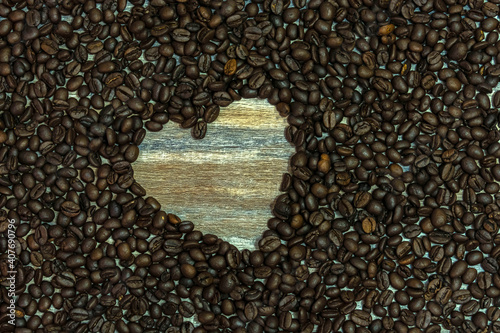 Heart symbol made of coffee beans on a wooden surface. Welcoming the day of love  February 14  Valentine Day.