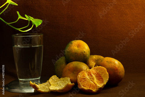 Fresh oranges on a brown background
