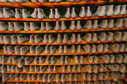 Blanks or pads for shoes are on the shelves in the cabinet in the shoe plant.