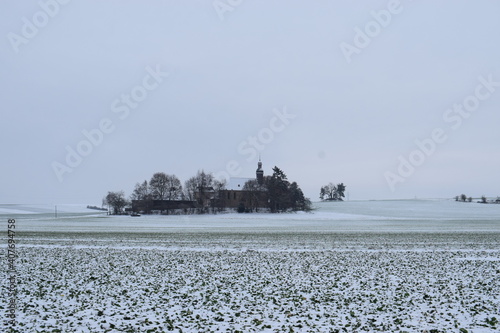 Kleine Siedlung Fraukirch im Schnee photo