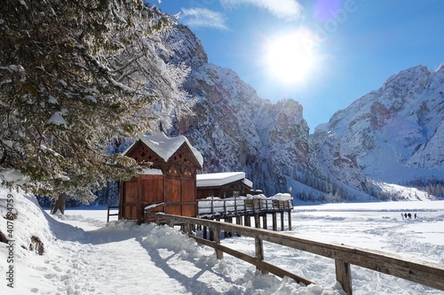 Boathouse on the beautiful lake Pragser Wildsee in South Tirol in wintertime photo