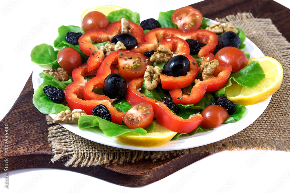 Fresh vegetable delicious vitamin salad for healthy eating on a white plate. Fresh vegetable delicious vitamin salad for healthy eating on a white plate.
