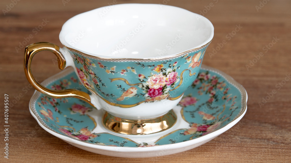 Porcelain tea and coffee cups on wood Porcelain tea and coffee cups on wood