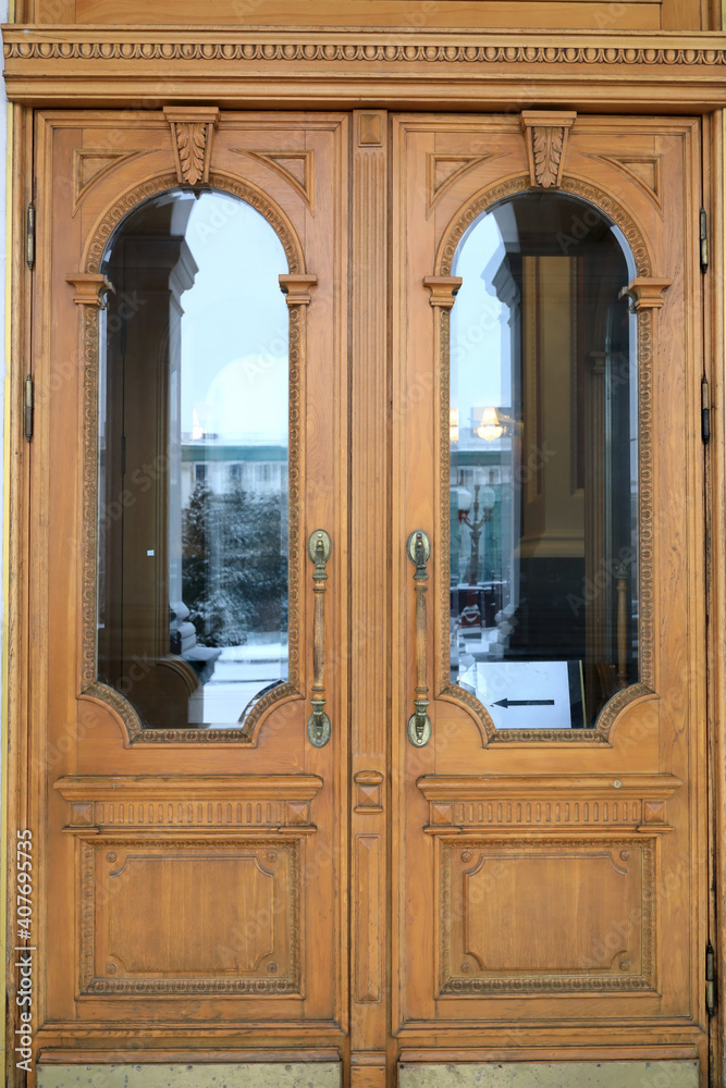 Wooden entrance door with mirrors