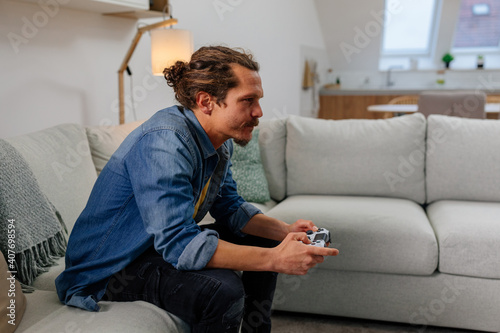 Man playing video games with joystick