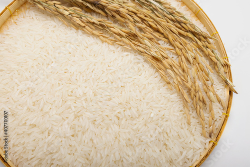 Close up of rice and paddy surface texture in basket bamboo on white background