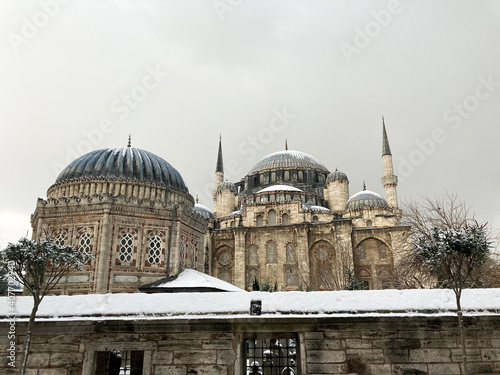 sehzadebasi mosque view in winter with snow photo