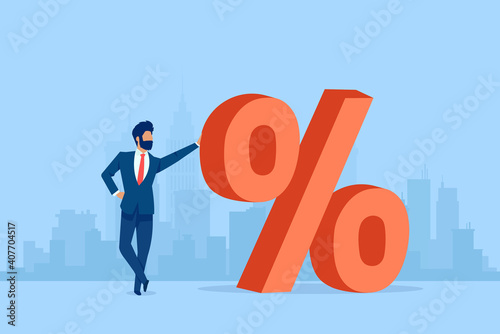 Vector of a business man standing next to a red big percentage symbol on a cityscape background