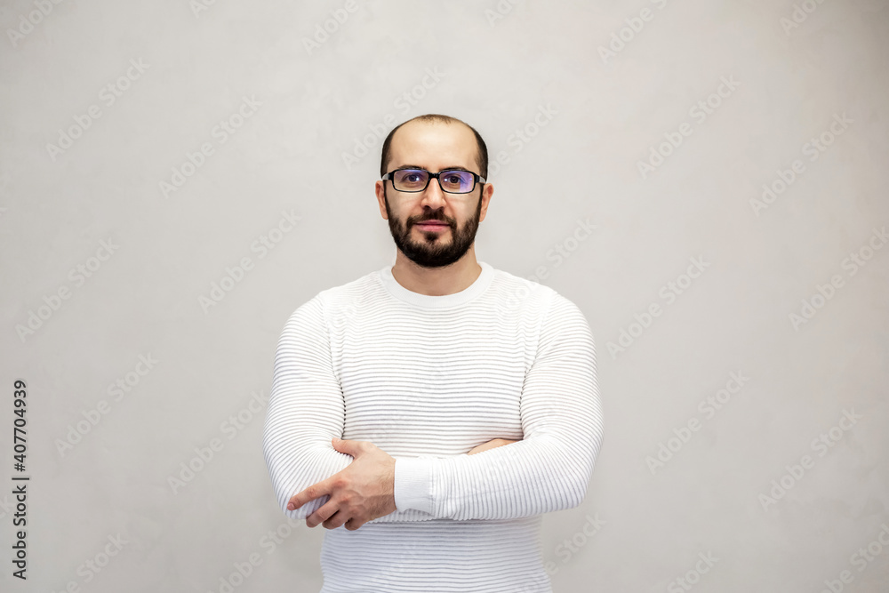 Portrait of a young man with eyeglasses. White background. Portrait of a young man with eyeglasses. White background.