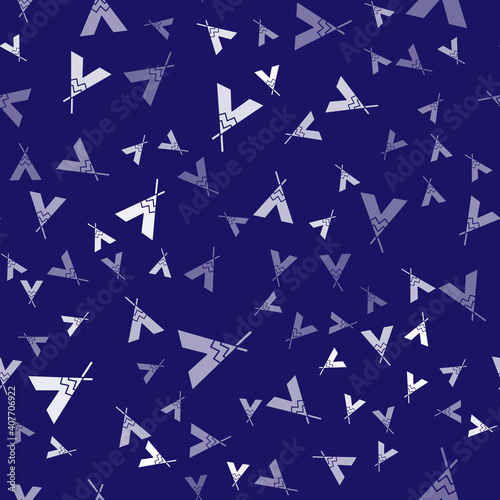 White Traditional indian teepee or wigwam icon isolated seamless pattern on blue background. Indian tent. Vector.