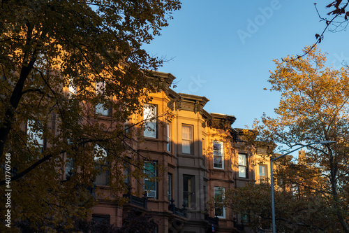 Row of Similar Old Brownstone Homes in Park Slope Brooklyn New York with Trees during Autumn