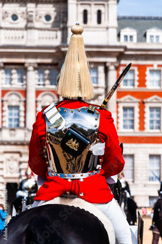 The Royal Guards in red uniform on horses, The Life Guards, Household Cavalry Mounted Regiment, parade ground Horse Guards Parade, Changing of the Guard, Old Admiralty Building, Whitehall, Westminster photo