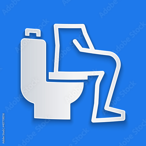 Paper cut Men sitting on the toilet and Constipation are experiencing severe abdominal pain icon isolated on blue background. Paper art style. Vector.